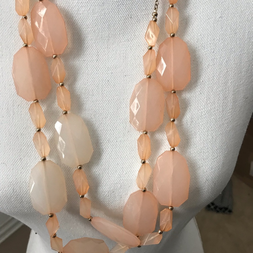 Long peach colored necklace